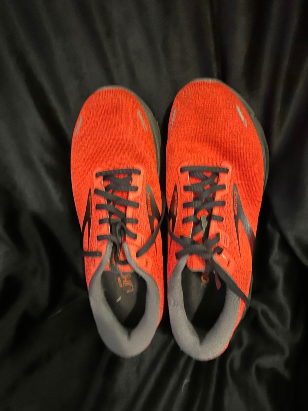 Women's red with black trim Brooks running shoes - size 9